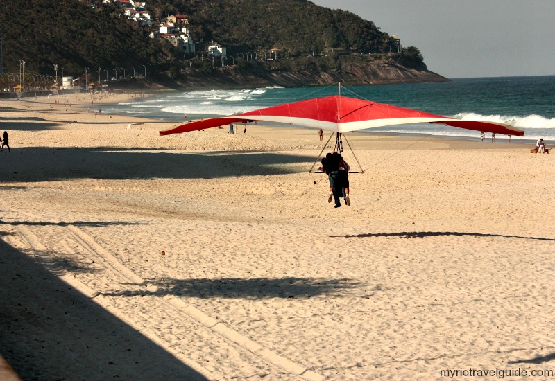 Hangliding landing in Sao Conrado Beach in Rio de Janeiro